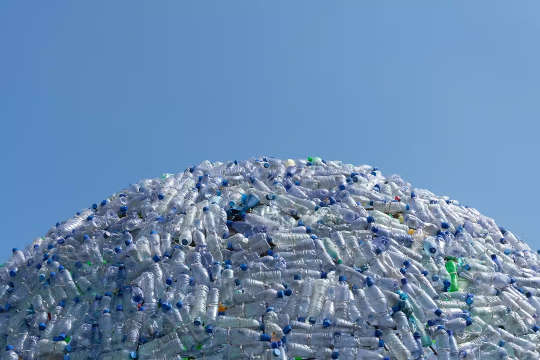 a huge pile of empty plastic water bottles